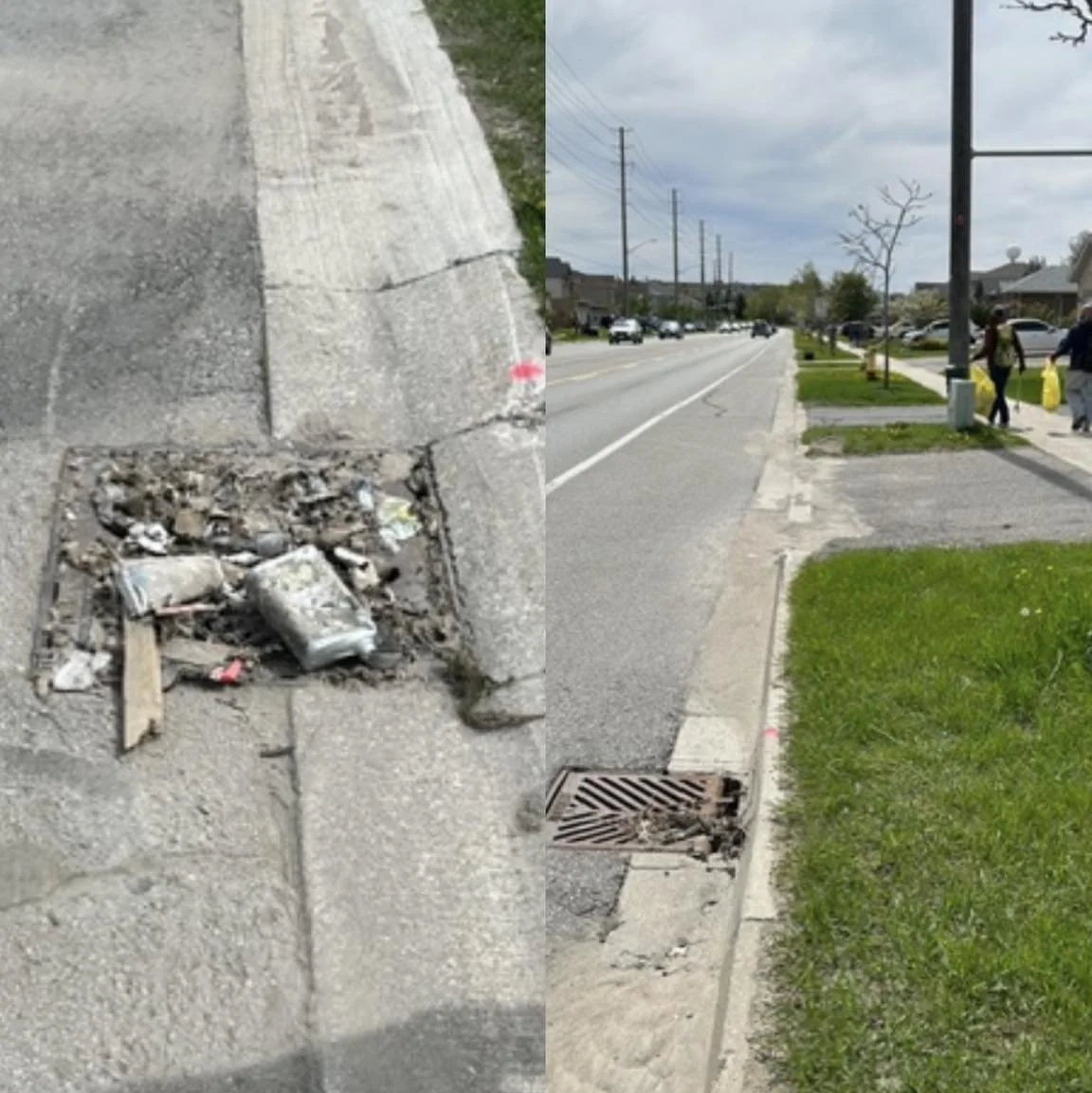 Sidewalk with a pothole filled with debris and fallen leaves, and an adjacent storm drain, with a city street, cars, pedestrians, and trees in the background.