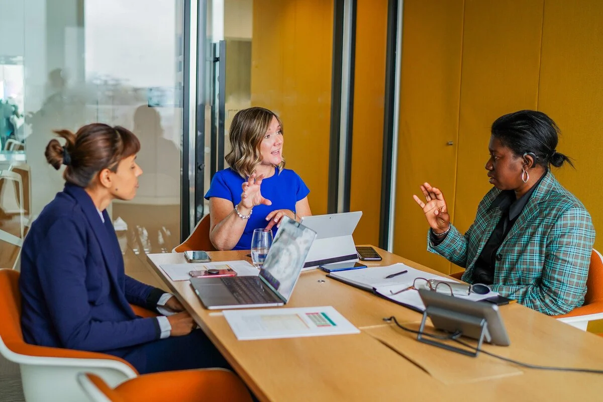 Group of people with diverse disabilities in a work meeting