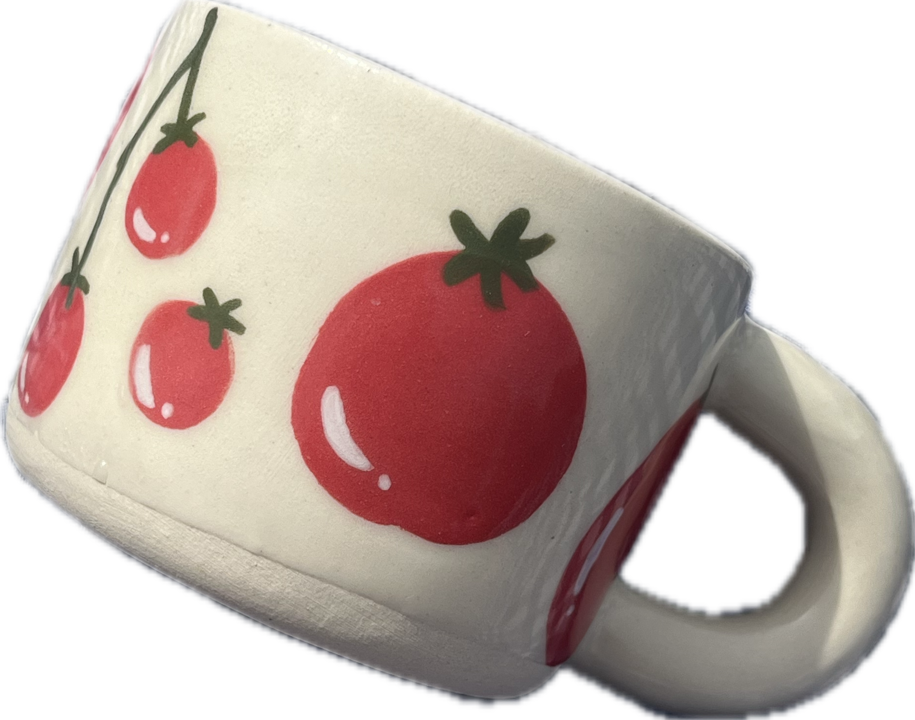 Close-up of a white container with red tomatoes and green leaves illustration on its surface.