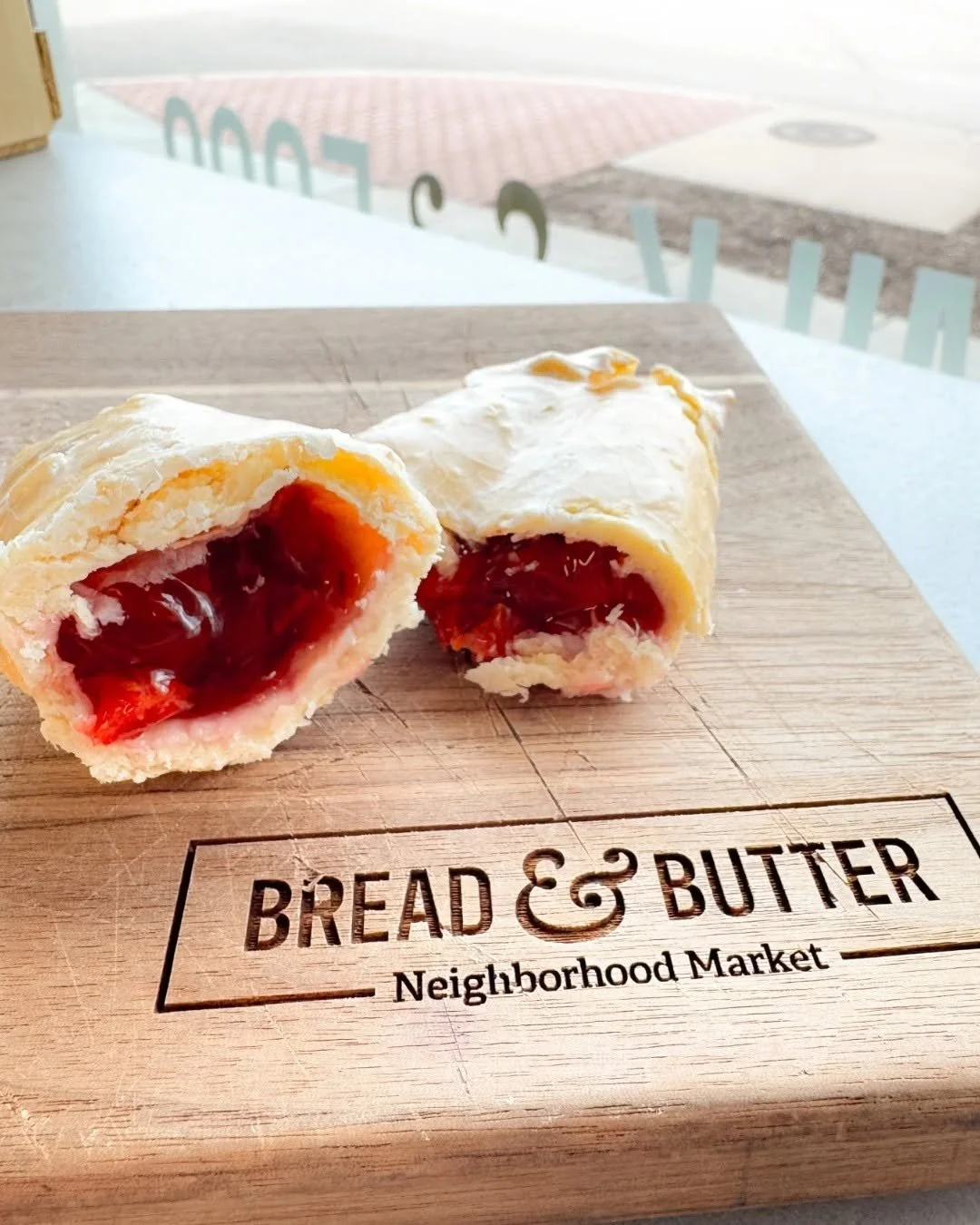 Cherry hand pie on a cutting board