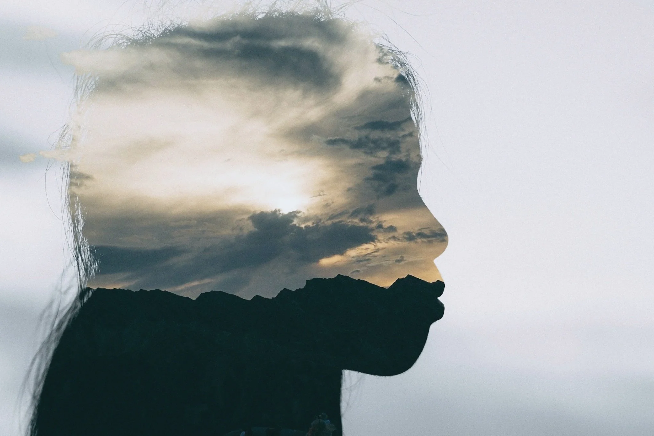 Image of a face with clouds to symbolize deeper processing and healing achieved through Brainspotting therapy