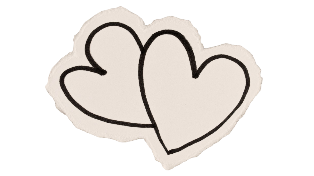 Two overlapping hand-drawn hearts in black outline on a torn piece of paper.