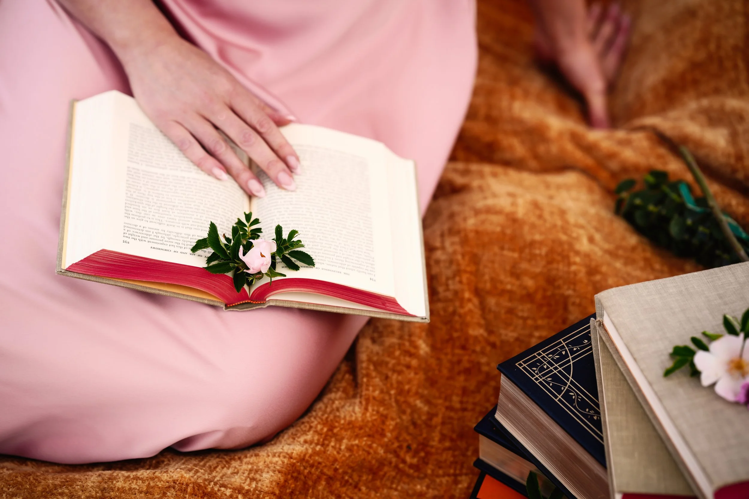 Karen Bommentre, LMFT, sitting with a book, Wild Gem Therapy services