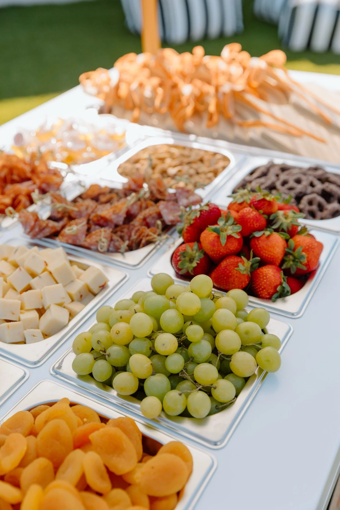 Close view of meats, cheeses, fruit and accompaniments on the Yes Please cart