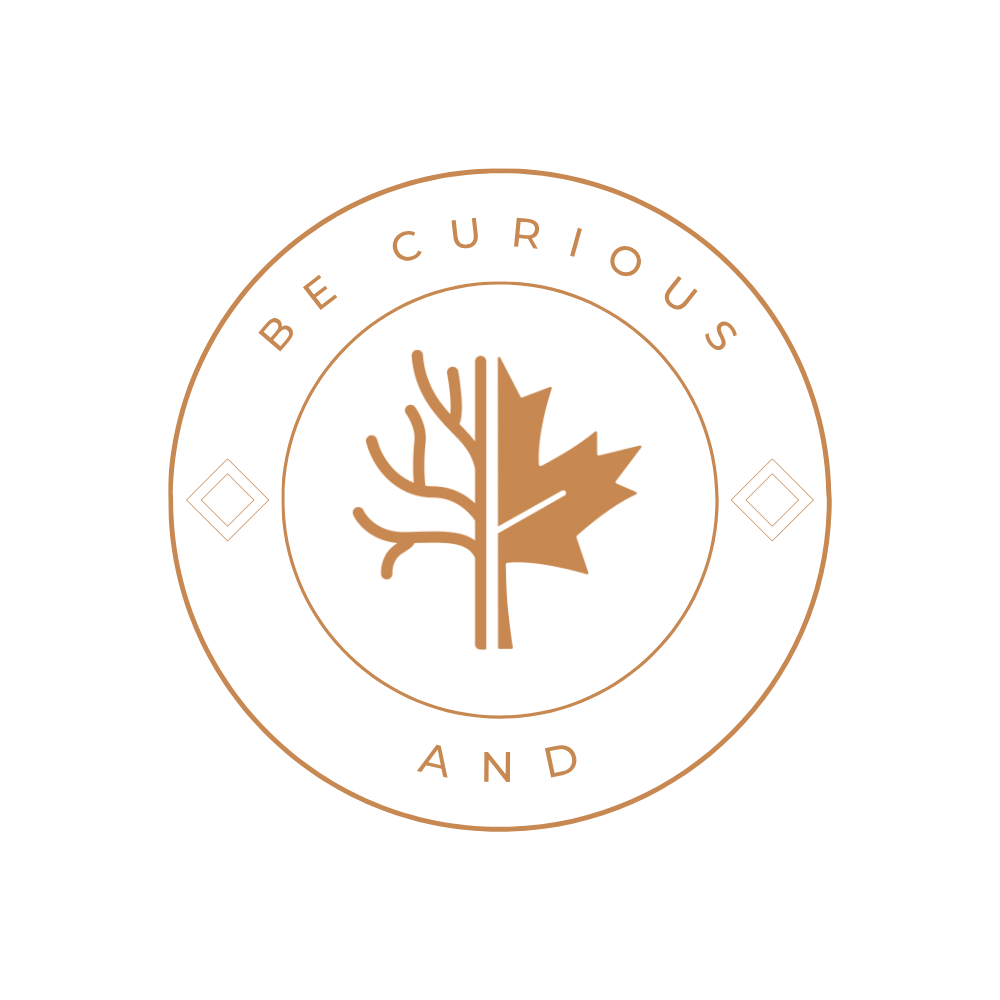 A circular logo with a black background, featuring a stylized tree divided into two halves: one side with bare branches and the other with a maple leaf. Surrounding the tree, the text reads 'BE CURIOUS AND' at the top and bottom.