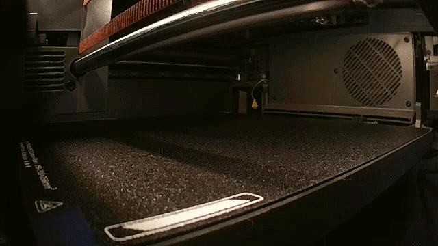 Time lapse of a 3D printer showing the print bed printing terracotta tract holders.