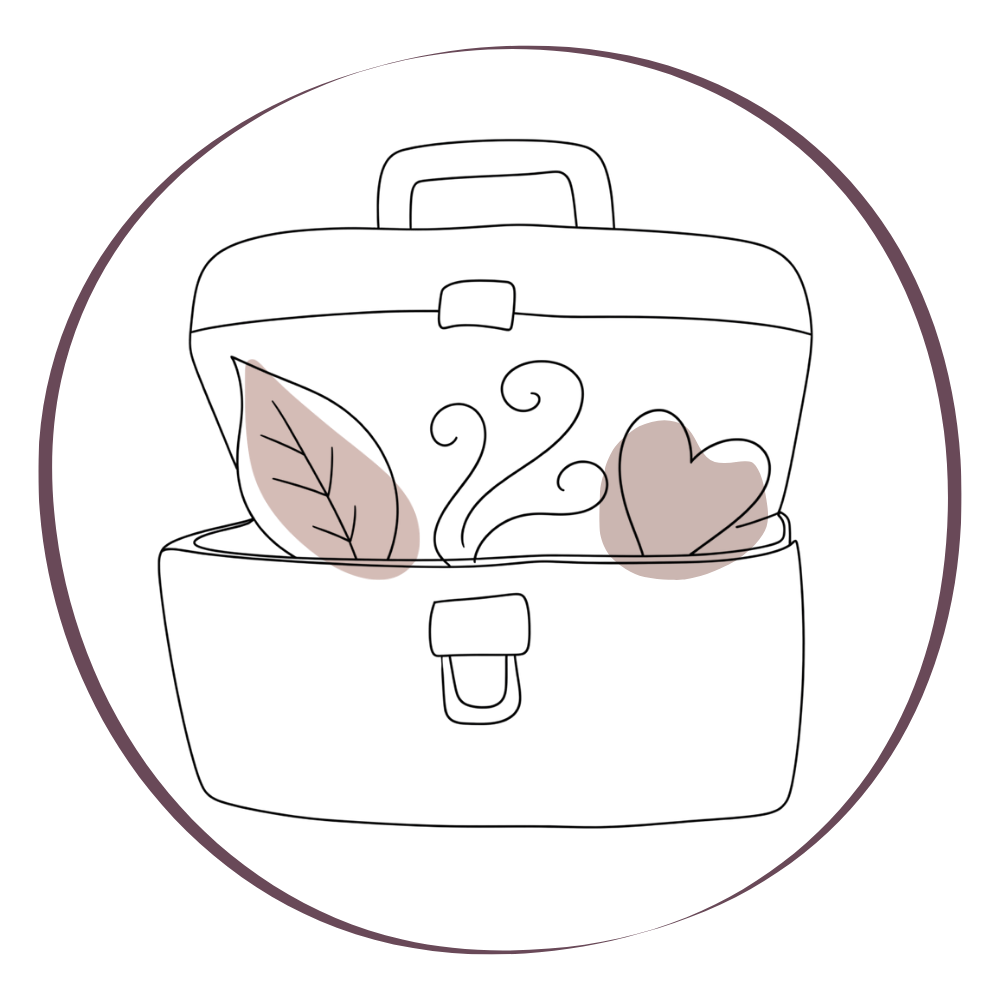 Une boîte de thé noire avec deux feuilles blanches dessus.