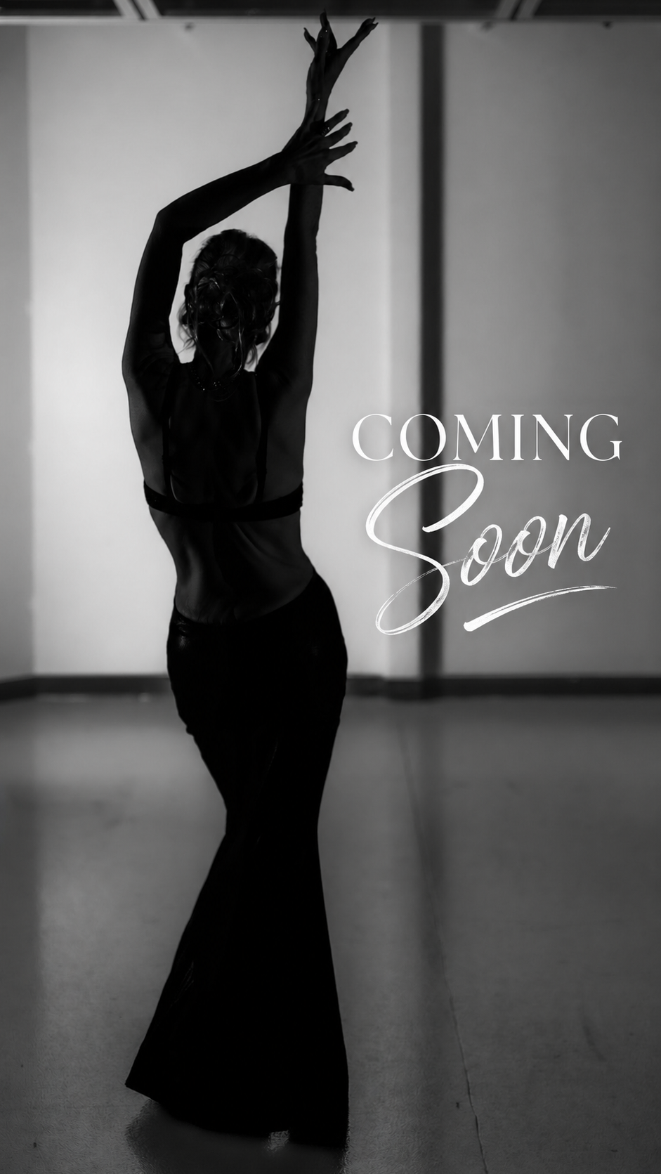 A black and white photo of a woman dancing with her arms raised above her head in a dance studio. The words 'Coming Soon' are written on the right side of the image.