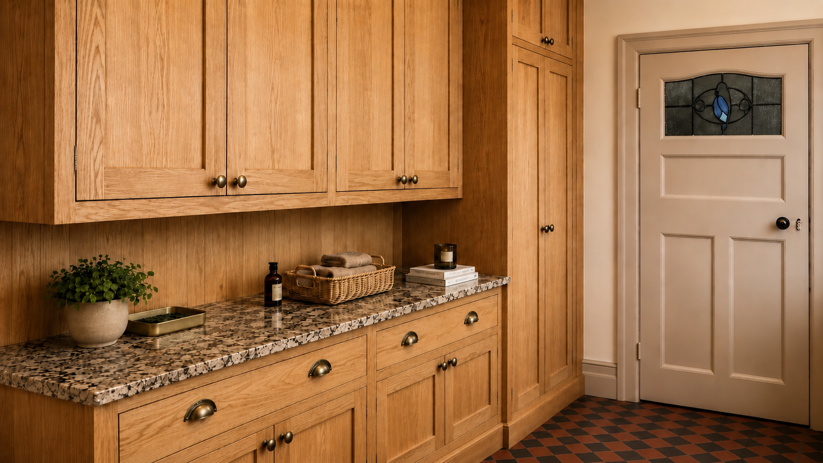 Aged Ash cabinetry making use of the available ceiling height. Huge wall cabinets make for plenty of storage. Made to the clients exact design and specifications.