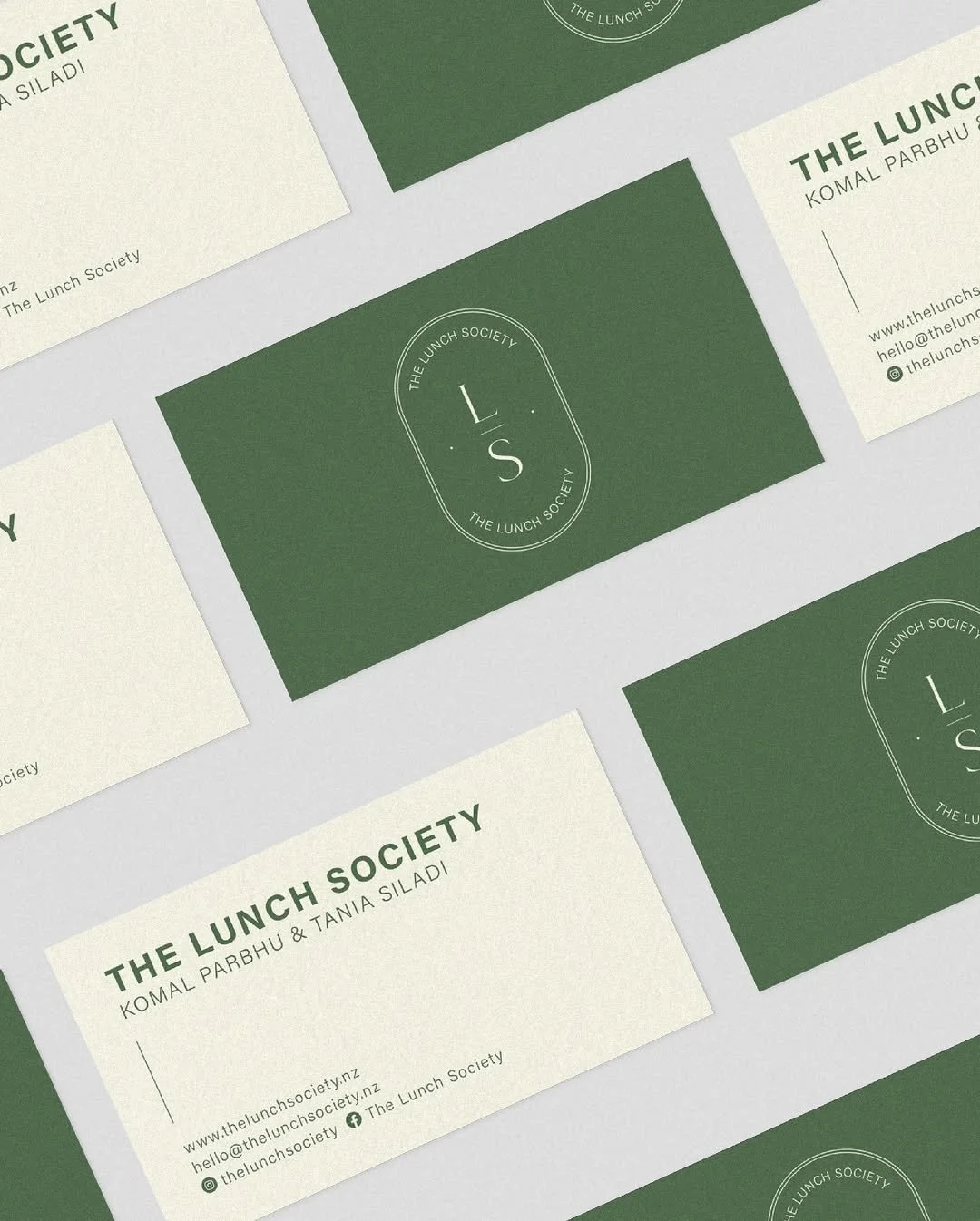 Business cards for The Lunch Society featuring the logo and contact information.