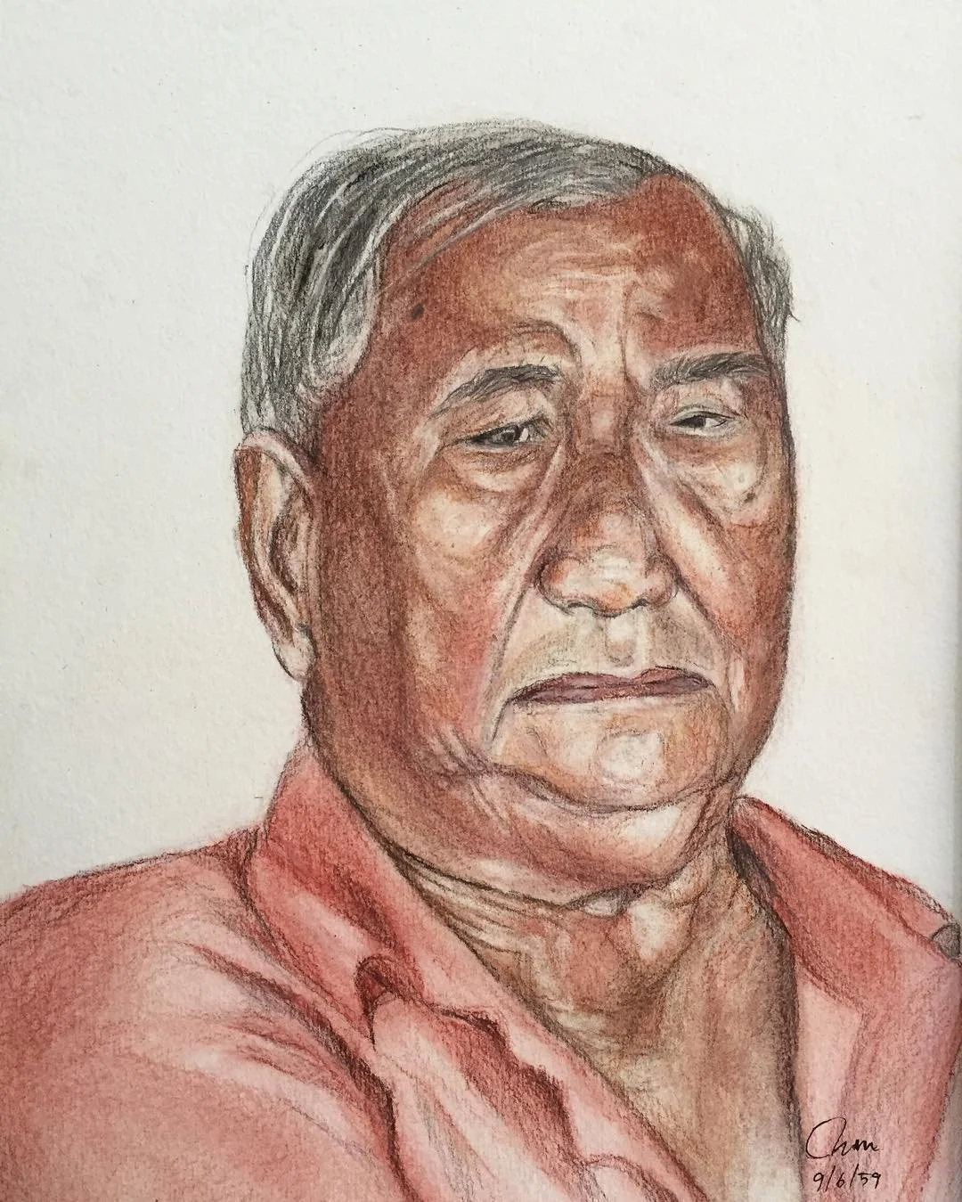 A realistic colored pencil portrait of an elderly man with gray hair, wearing a reddish shirt, with a somber expression, on cream-colored paper.