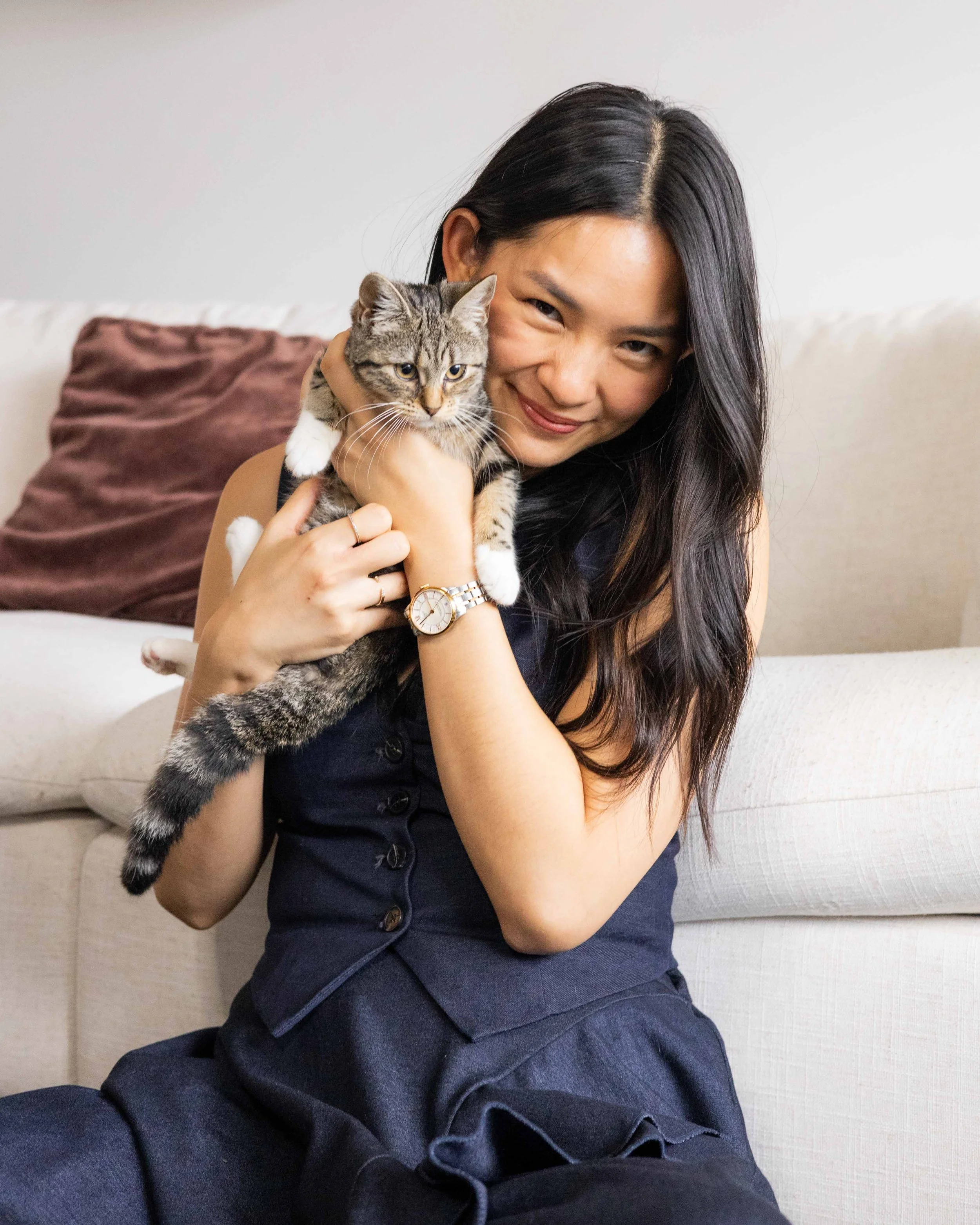 Olivia Lei holding her cat Junie.