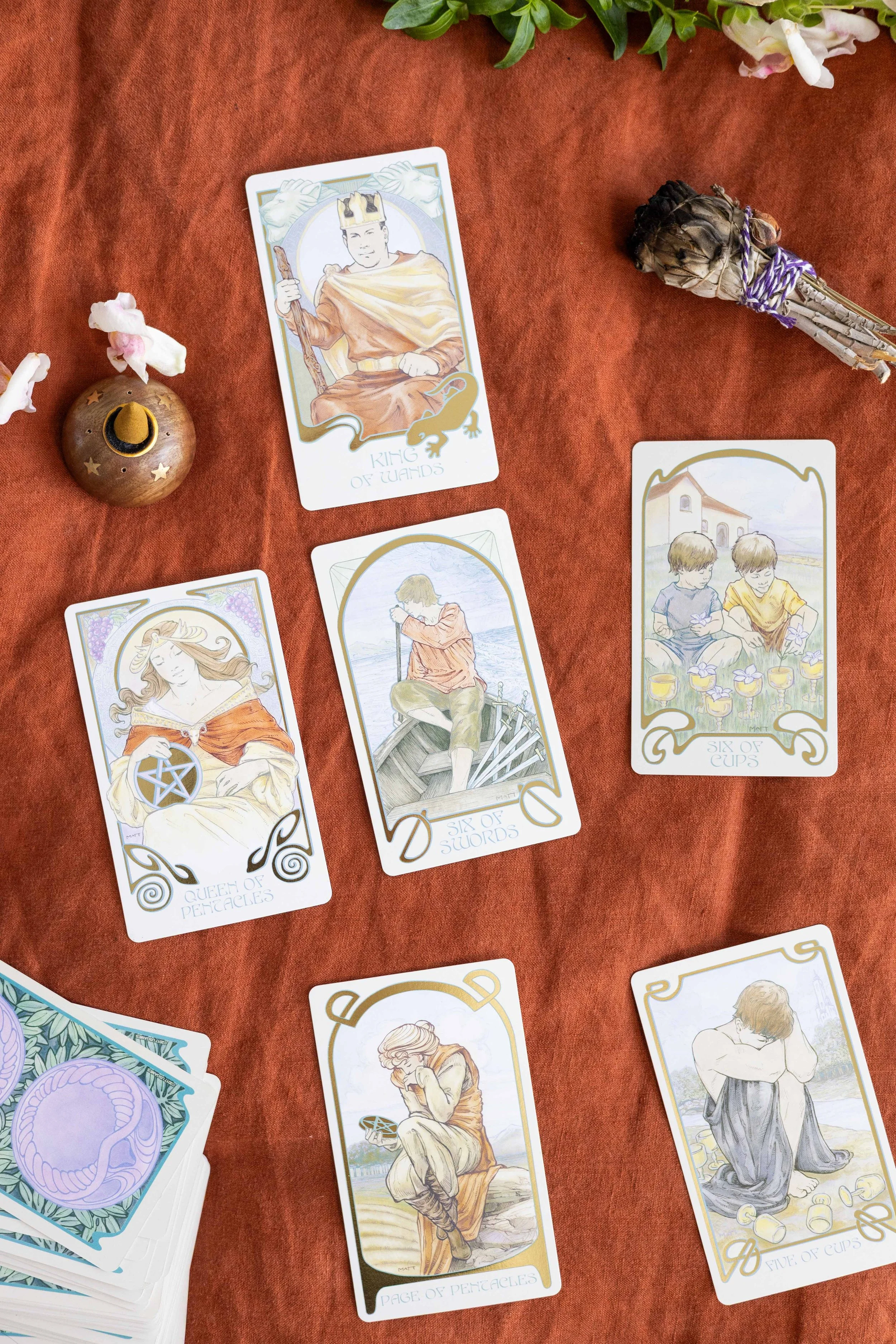 A six-card tarot spread laid out during a psychic reading.
