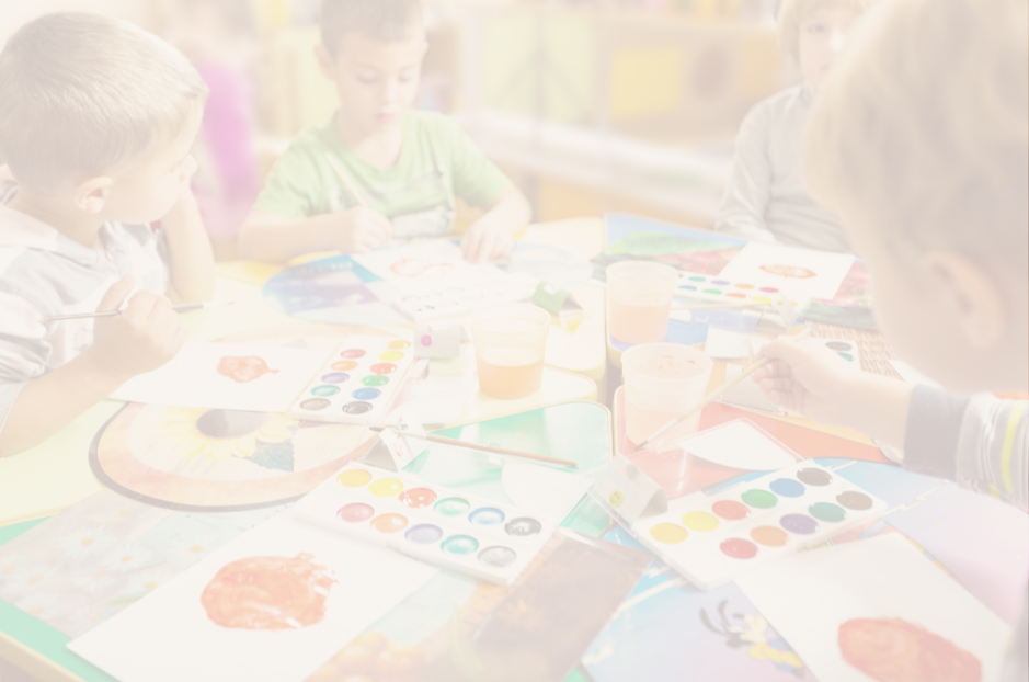 Children engaged in painting and watercolor activities at a table.