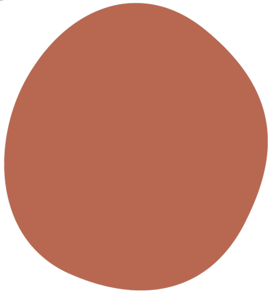 A close-up of a human finger with a round, brown nail.