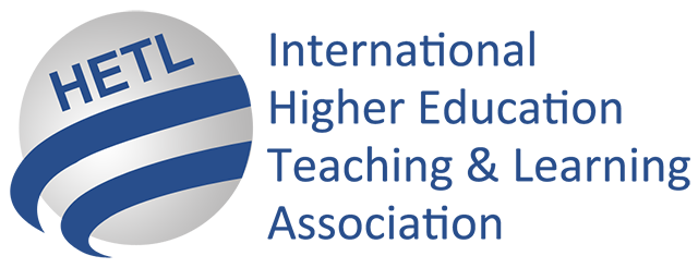 Close-up of a logo with the text 'HETL' above curved blue and gray stripes.