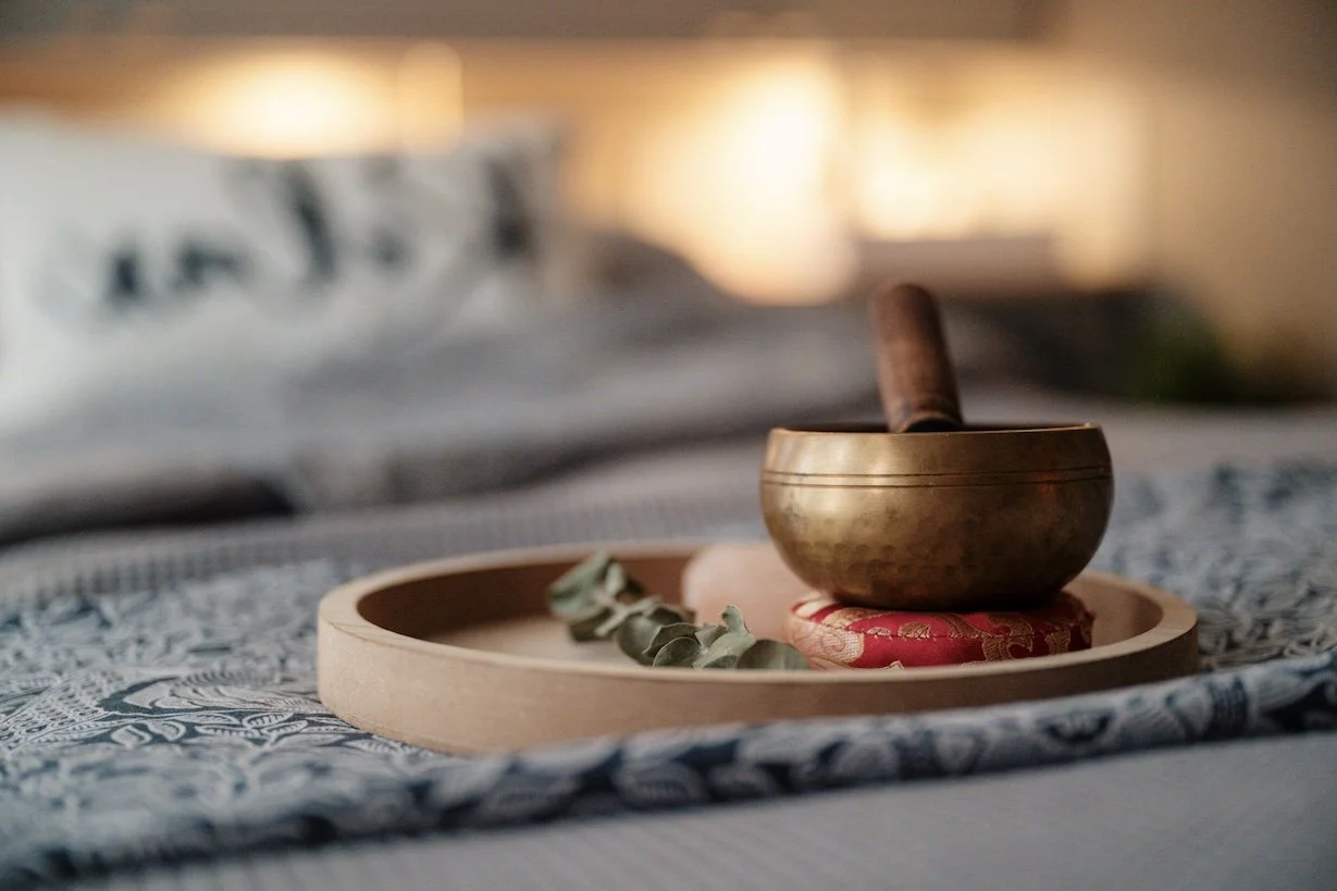 Bowl of essential oils and natural therapy products used in holistic treatment