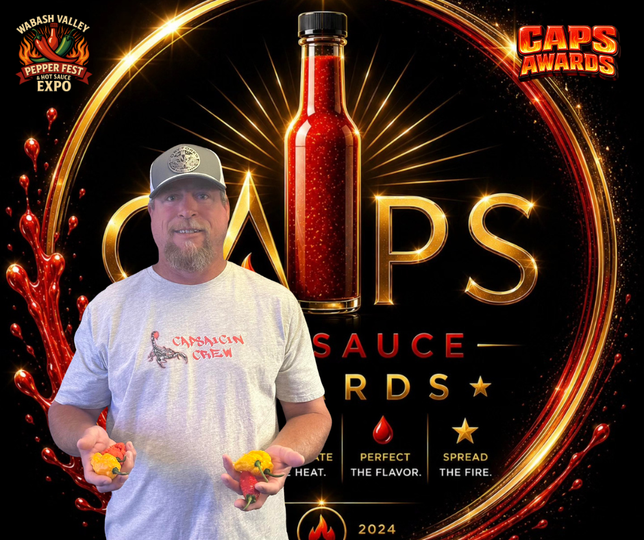 A man standing in front of a digital background with the text 'Caps Awards' and an image of a hot sauce bottle. The man is wearing a gray Capalcin Crew T-shirt and a baseball cap, holding several hot peppers in each hand.
