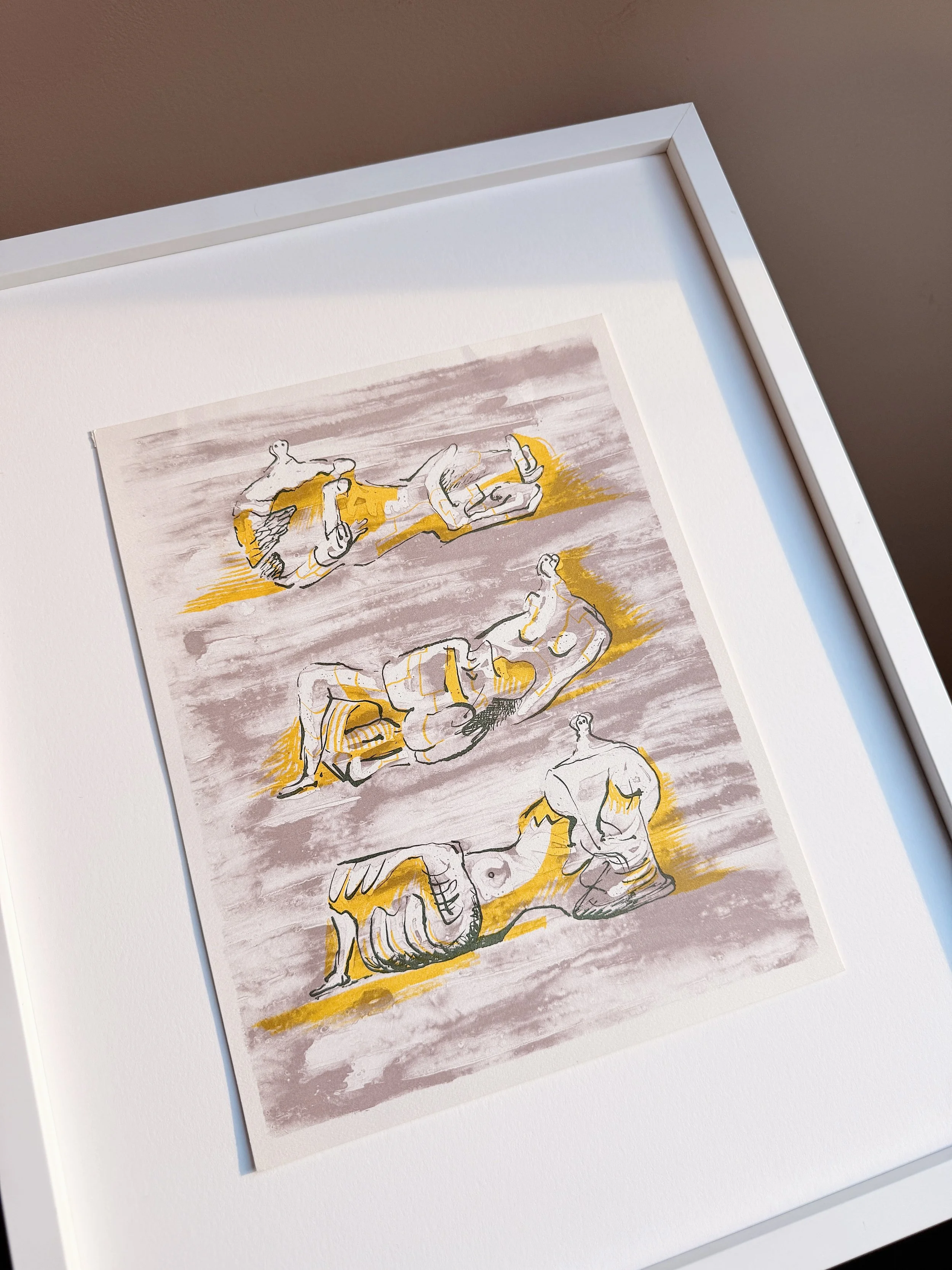 A framed sketch of several classical sculptures and figures, rendered in shades of brown, black, and yellow.