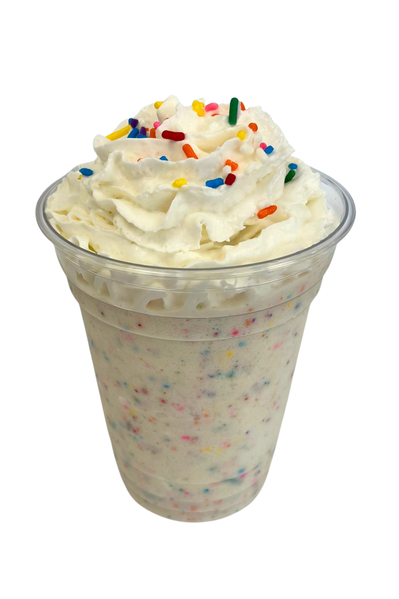 A cup of birthday milkshake topped with whipped cream and colorful sprinkles.