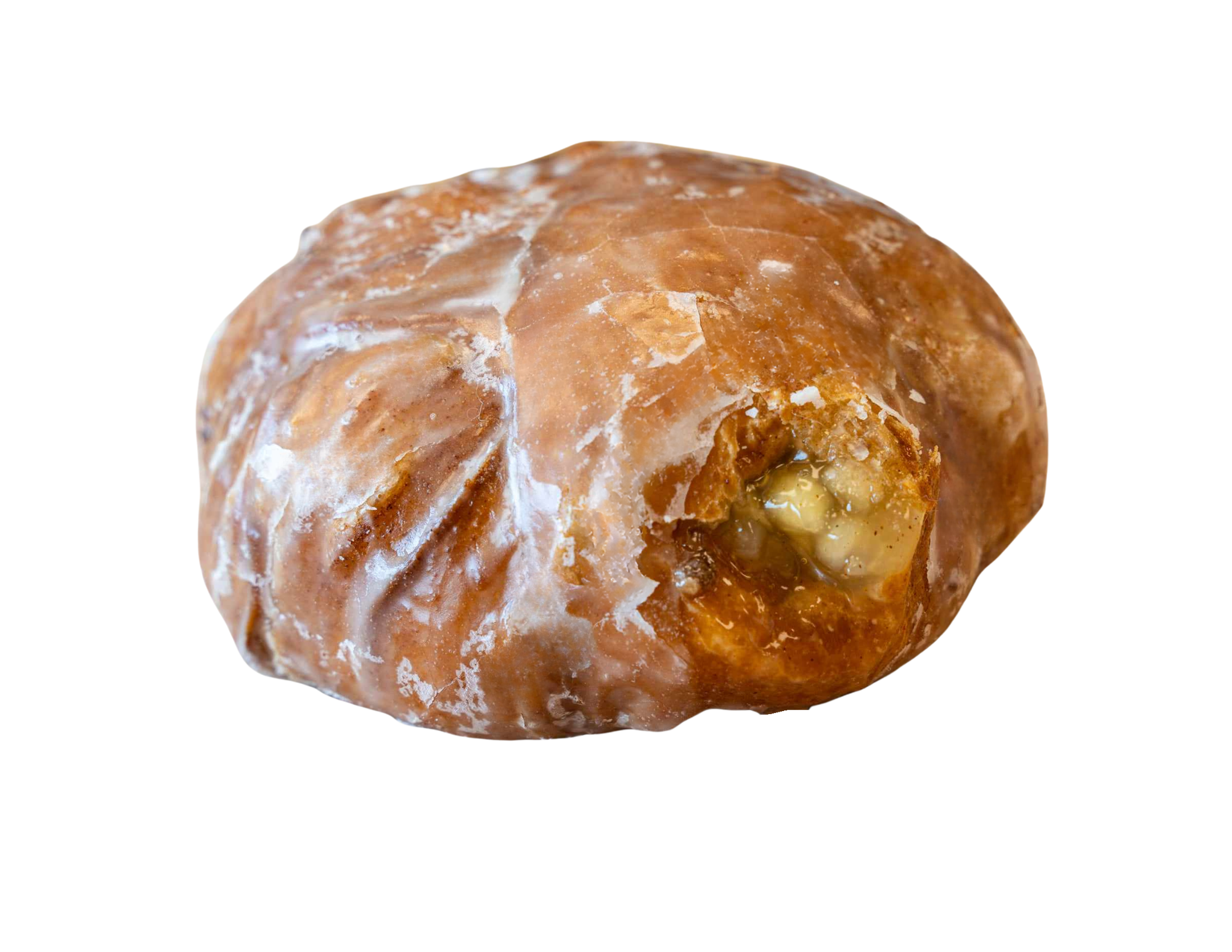 Close-up of a caramel candy or caramel-filled confectionery with a nut piece inside.