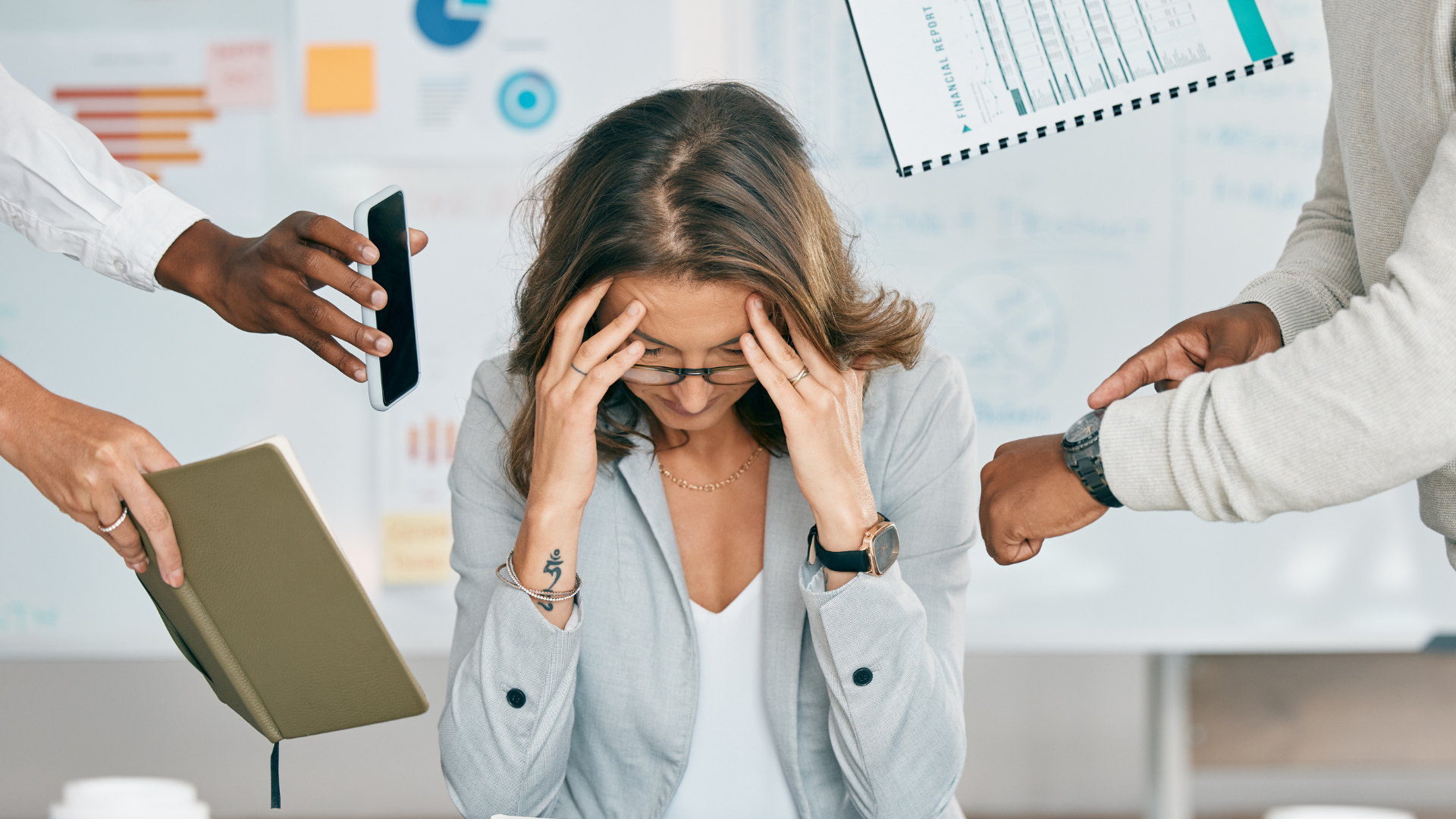 Stressed woman surrounded by demanding colleagues holding phone, notebook, and report.
