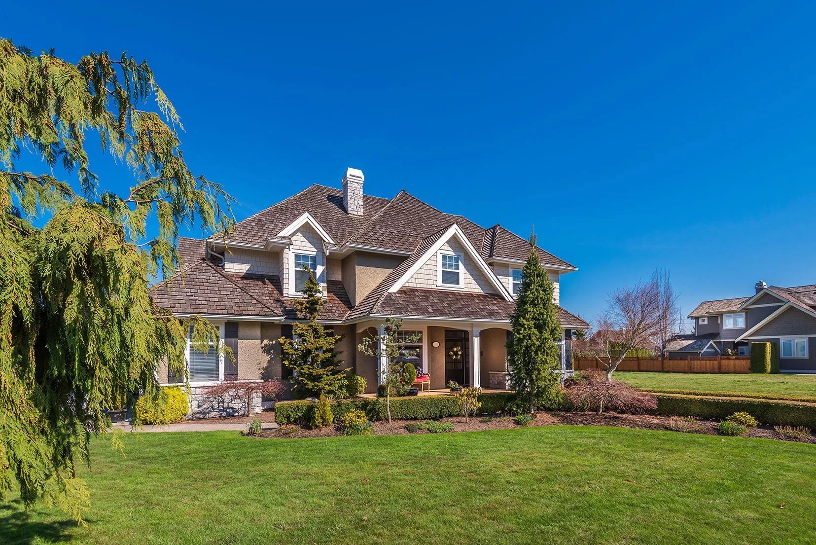 Beautiful suburban home with bright green lawn