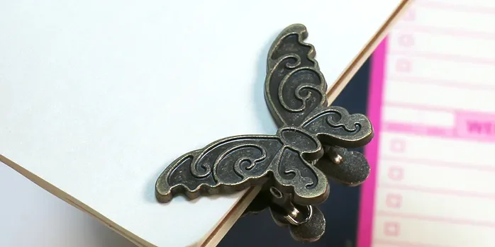 brass buttertfluy clip-.webp