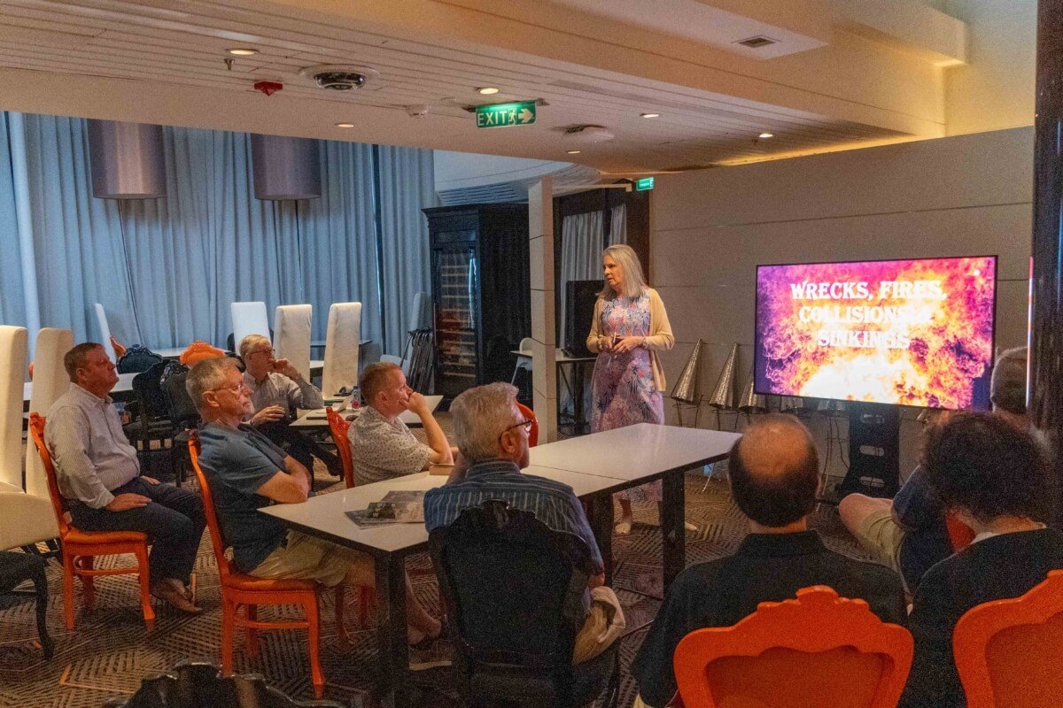 Chairperson Denise Dacey welcomes members and guests to our Anniversary cruise. 