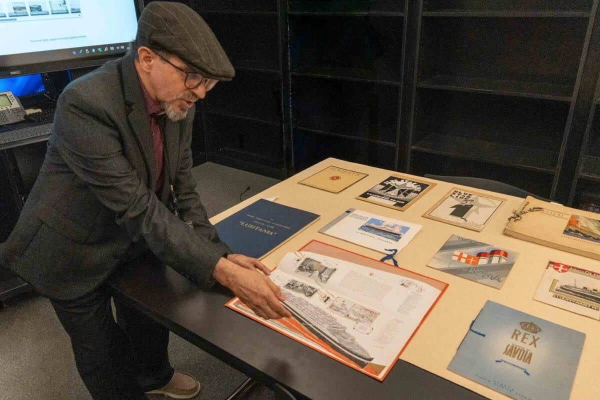 Wolfsonian Chief Librarian Frank Luca explaining one of the items on exhibit.