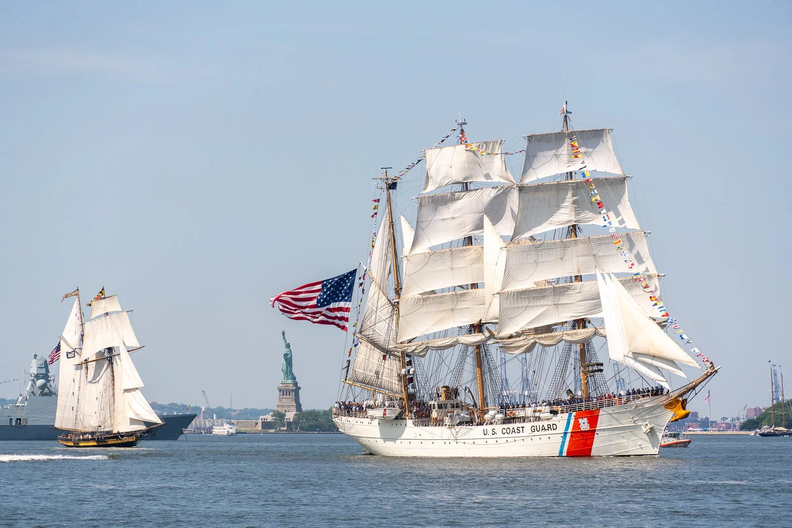 SAIL4TH 250 flagship 1936 USCG EAGLE ahead of 1988 PRIDE OF BALTMORE II, New York Harbor, NY, July 2026 (Stuart Gewirtzman)