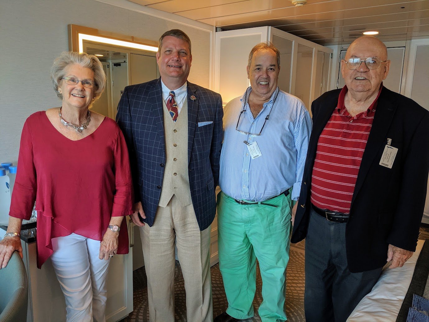 2019 Bermuda PONY Group Cruise, Chairperson Pat Dacey (center left) with maritime artist Steven Payne (center right).