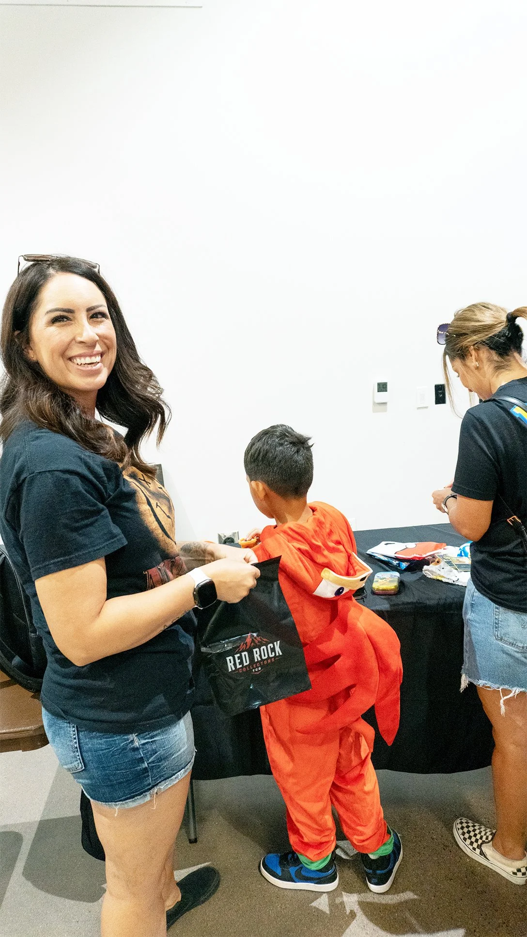 Family enjoying Pokémon trading cards at Red Rock Collectors Sports & TCG Expo.