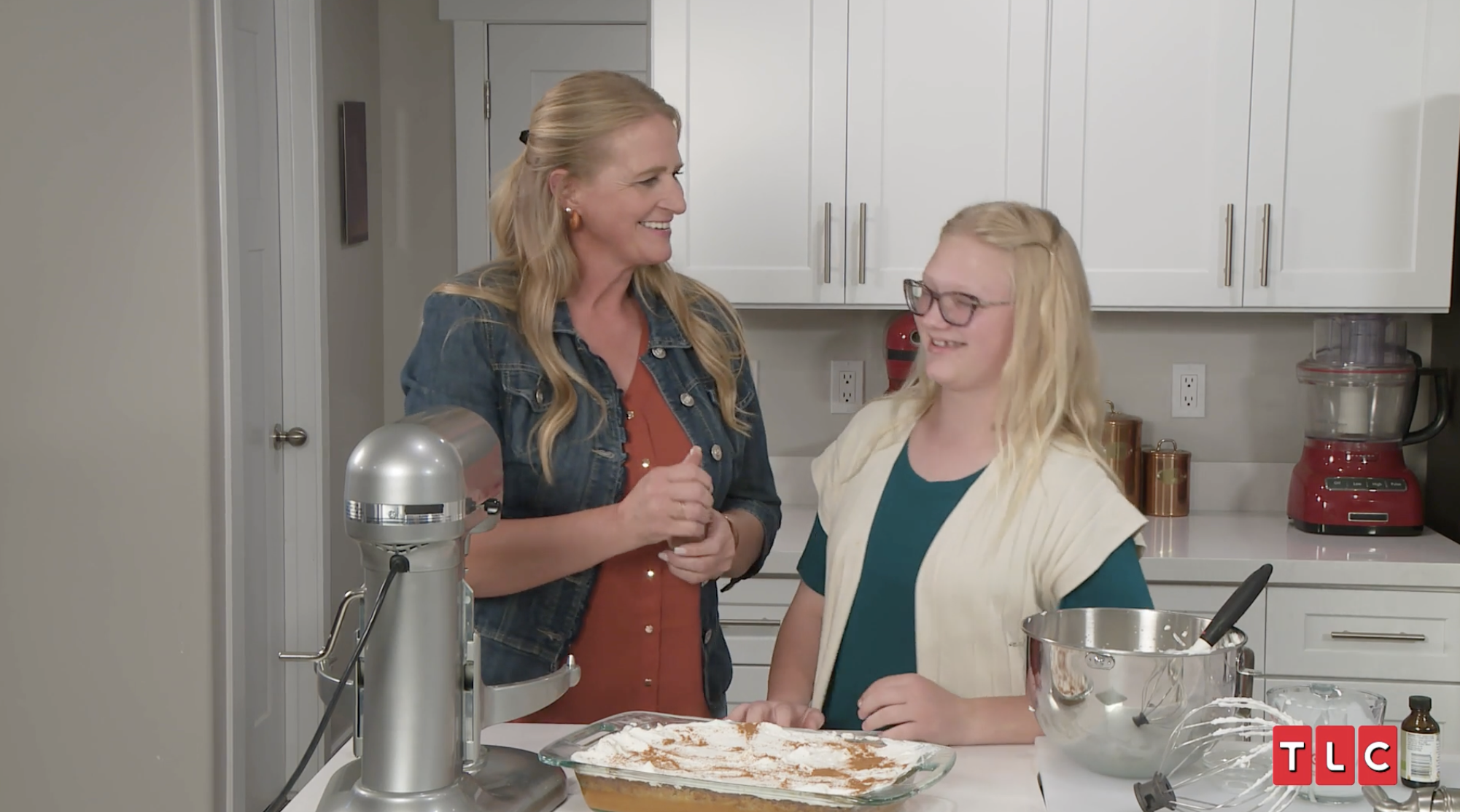 Christine Brown and Truely Brown from Sister Wives cooking in a kitchen.