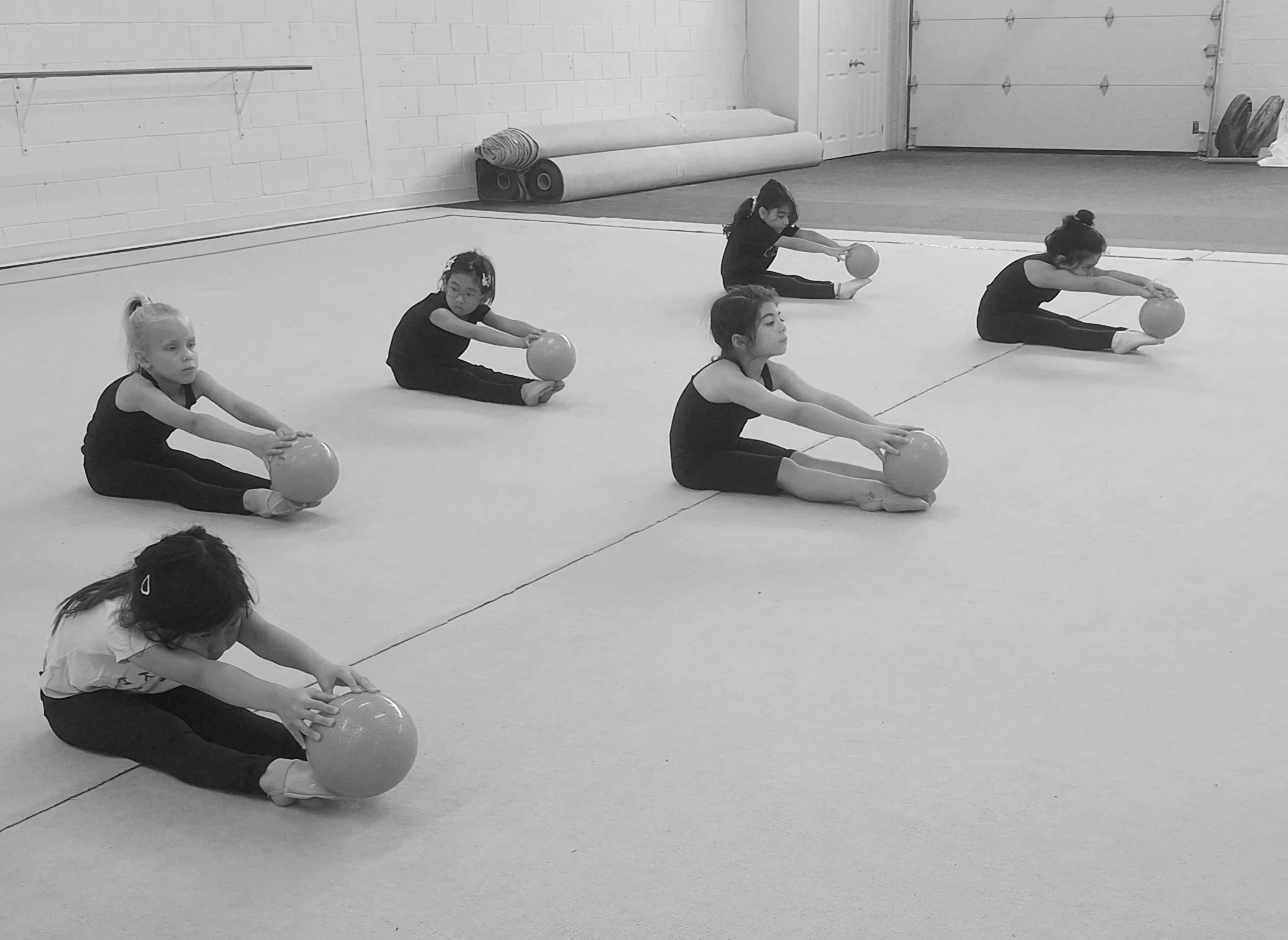 Young gymnasts learning ball skills during a recreational rhythmic gymnastics class at Elite Rhythmic Centre.