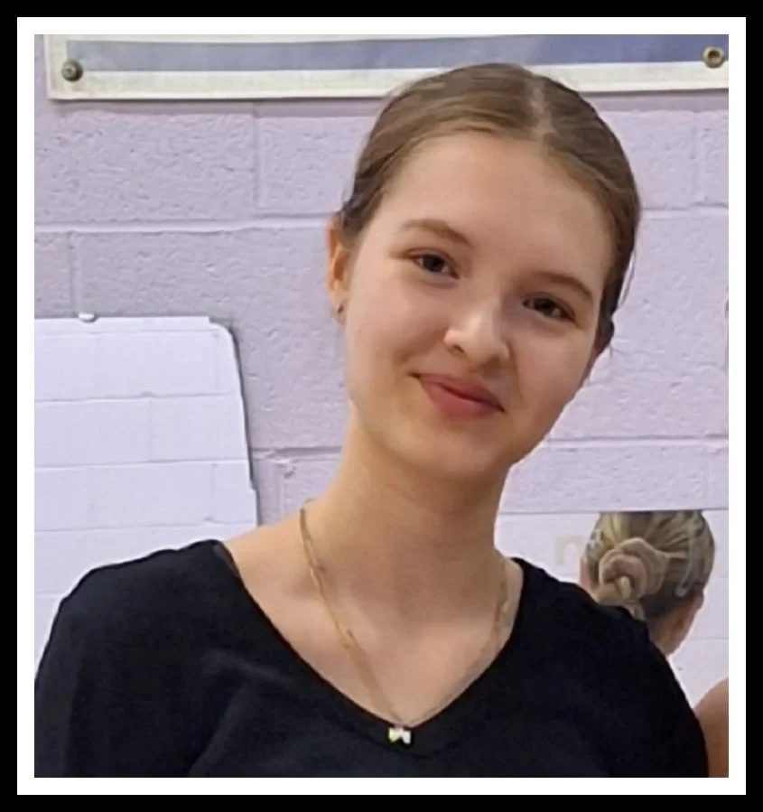 Portrait of Masha, assistant rhythmic gymnastics coach at Elite Rhythmic Centre.