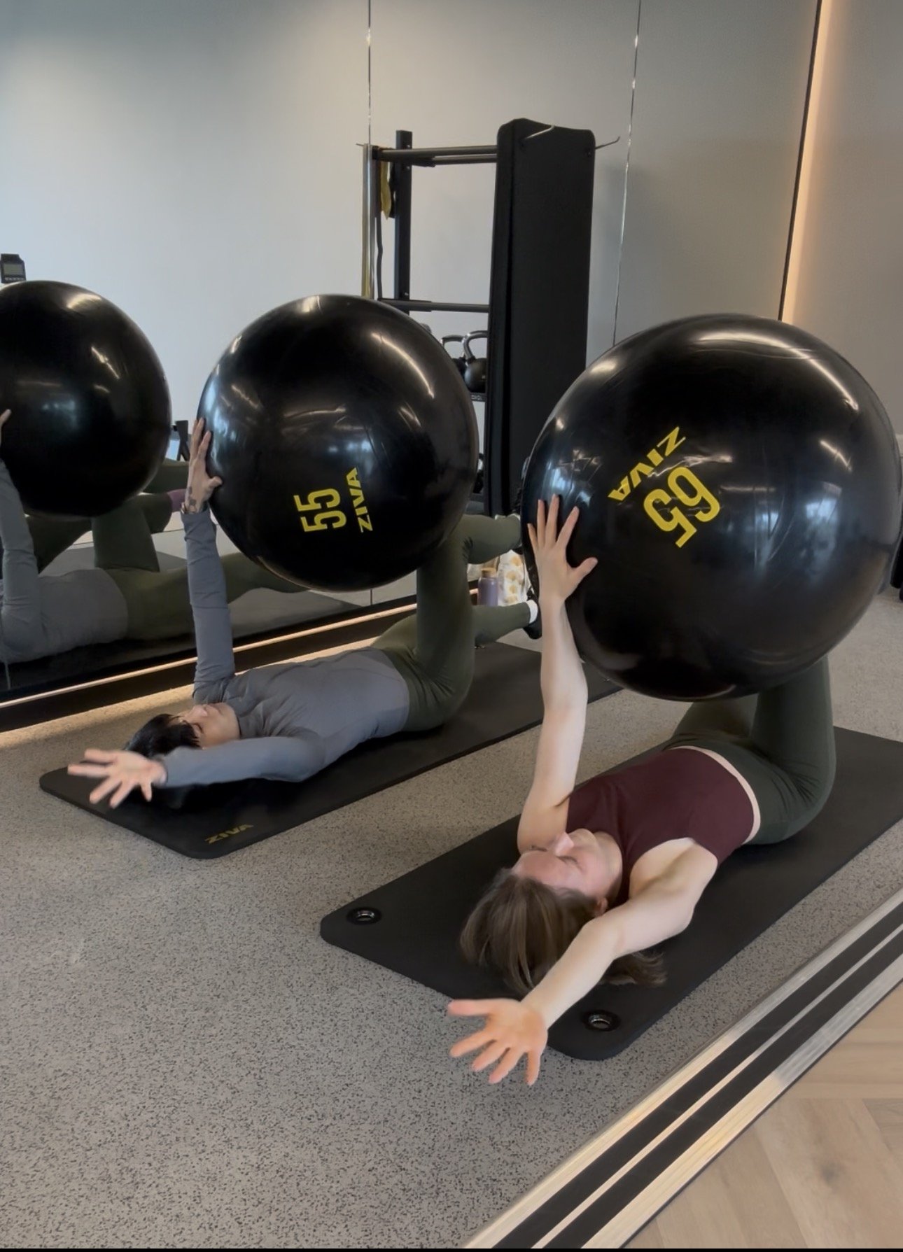 Small group fitness session focused on core strength and exercise technique in Canary Wharf.