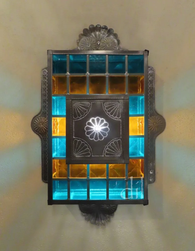 Across the plaza at La Fonda, the crown jewel of Santa Fe's luxury hotels, every detail, down to the doorknobs and wall sconces, is a work of art.