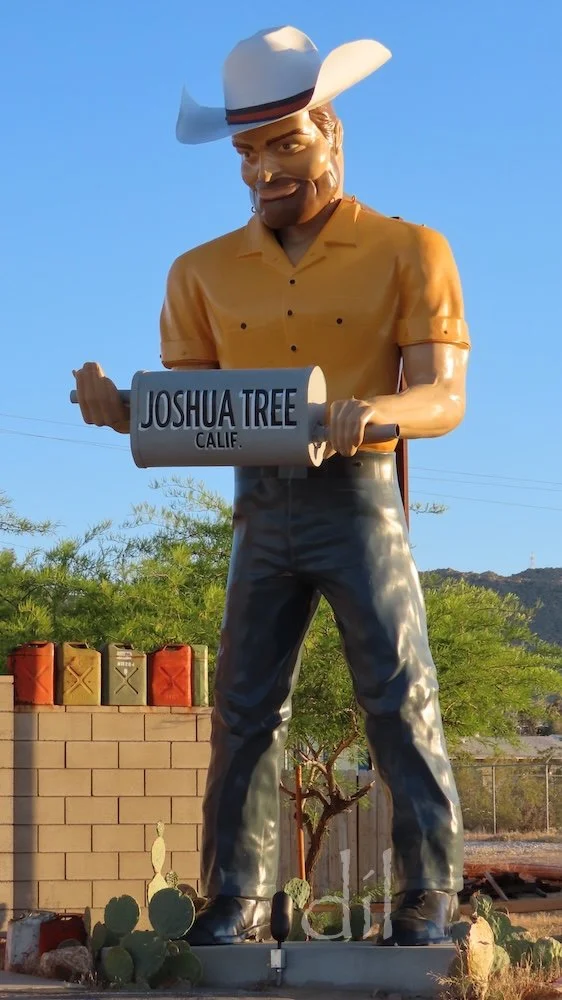 Rescued from the scrap heap, Big Josh the muffler man cowboy, stands outside The Station Joshua Tree souvenir shop, itself housed in a 1949 gas station.
