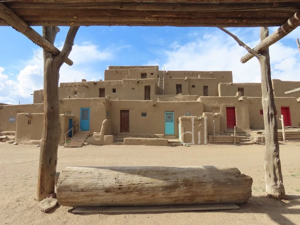 The largest surviving Pueblo structure, Hlaumma (North House) was originally built for defense, with walls several feet thick and ladder-only access to hatchways in the roofs. The colorful doors and multiple windows are more recent additions and make