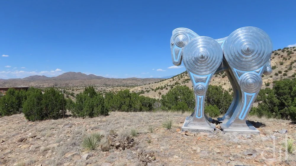The Turquoise Trail National Scenic byway traces the hills between Tinkertown and Santa Fe, passing through the artist colonies of Golden, Madrid and Los Cerrillos. Just north of Madrid, this striking horse sculpture by Siri Hollander marks the entra