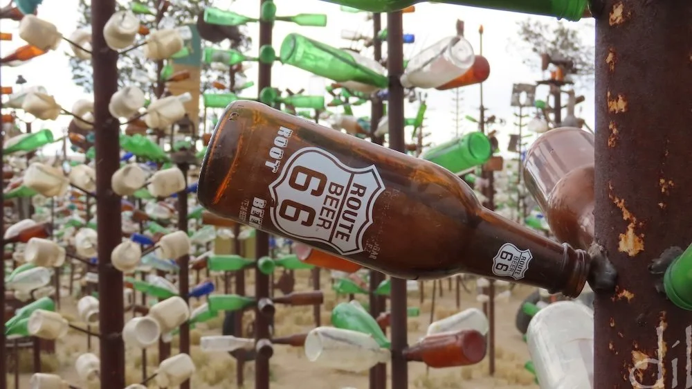In the 1950s Elmer Long and his father would gather and catalog bottles and other objects they found on long, rambling drives on and off Route 66 in the Mojave Desert. One day Long tied some of those bottles to a post in the yard and was delighted ho