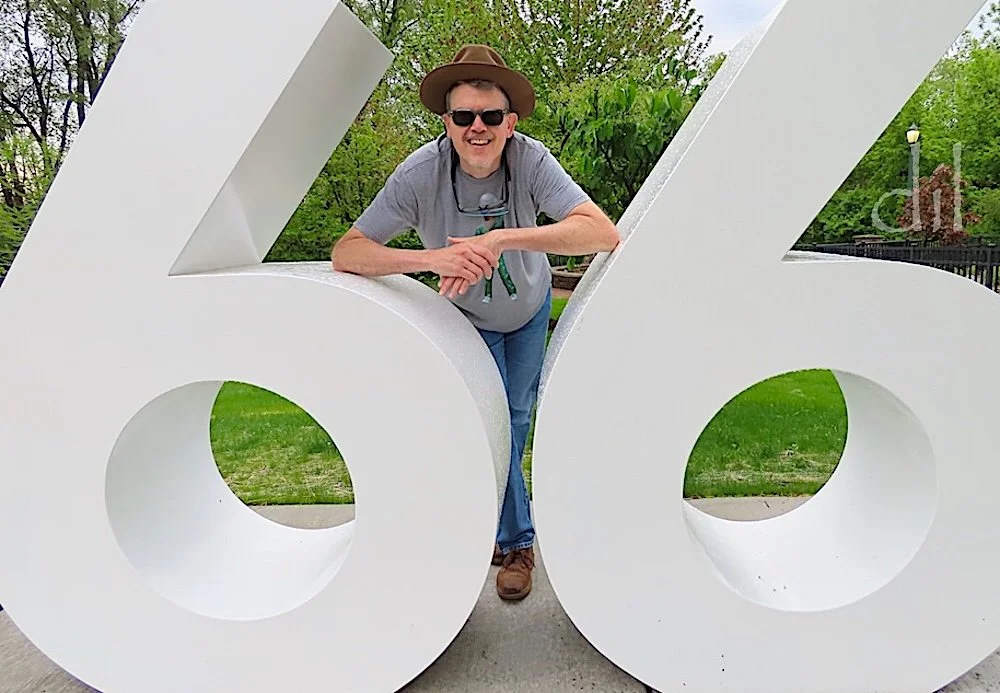 By the numbers at Route 66 Park in Joliet, Ill., a roadside pullout with a vintage gas pump, cars and the Rich & Creamy ice cream stand, capped by figures of the Blues Brothers of camp film fame.