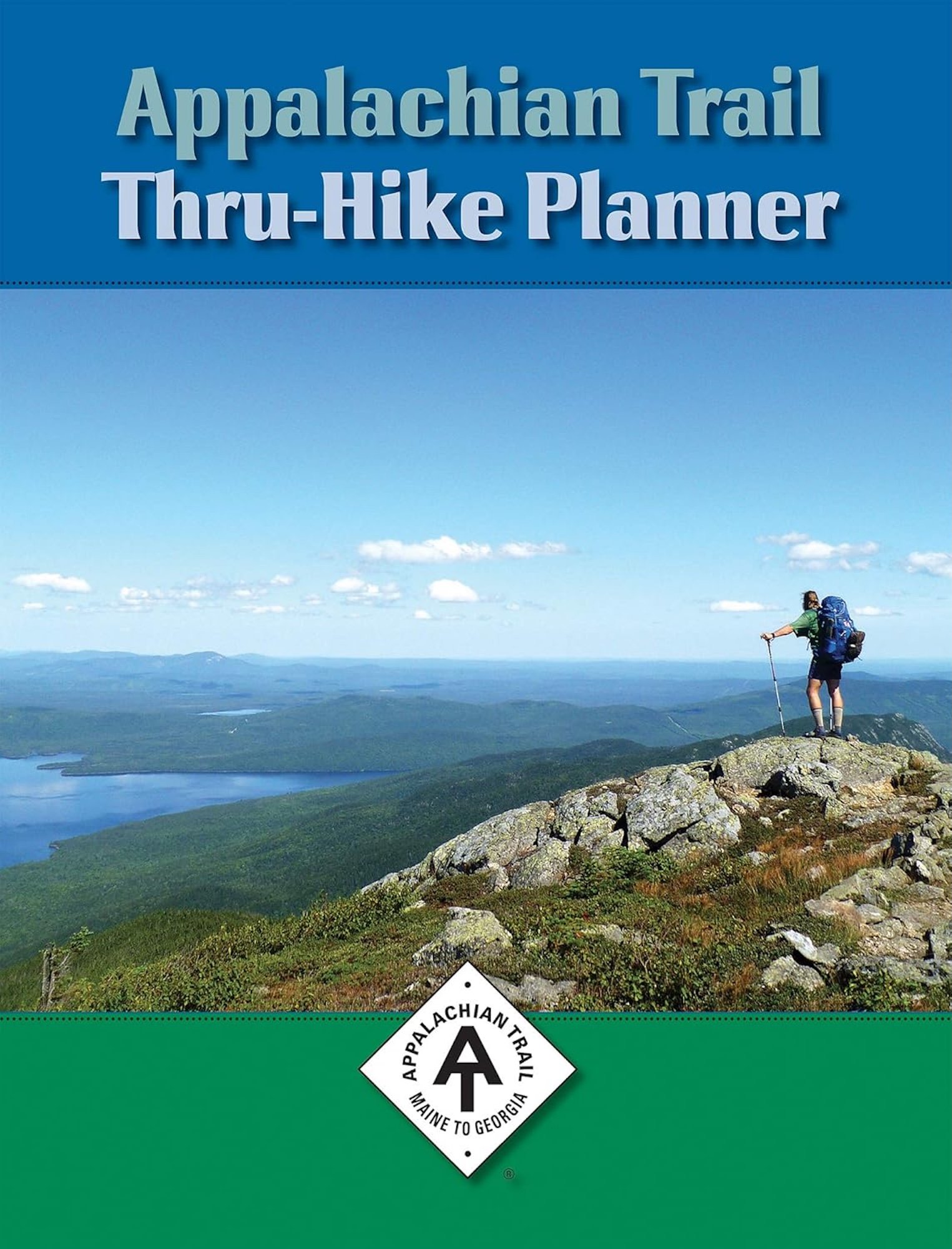 The cover of David Lauterborn's Appalachian Trail Thru-Hike Planner. Image shows a person hiking on a mountain trail, overlooking a vast landscape of lakes, forests, and mountains under a blue sky with scattered clouds.