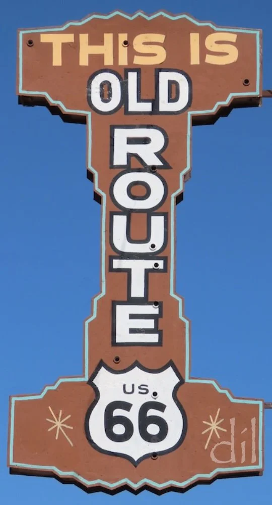 On the road again, look for this classic roadside sign on a freestanding pole. The mid-century modern styling and national park brown color speak to that time and place.