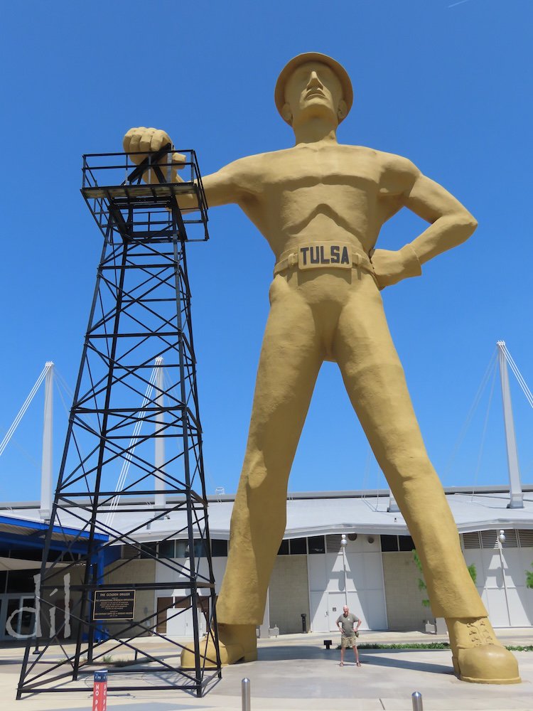 Soaring 75 feet (that's my father posing between its feet), Tulsa's Golden Driller is the nation's seventh tallest statue. Its hand rests atop an actual repurposed oil derrick. The statue stands beside the Tulsa Expo Center, which hosts the state fai