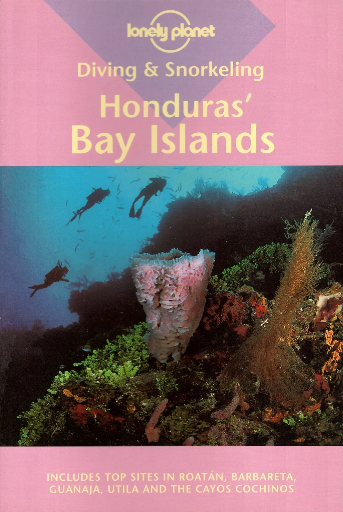 Cover of a guidebook titled "Lonely Planet Diving & Snorkeling Honduras' Bay Islands" with an underwater scene featuring two scuba divers swimming above colorful coral and fish.