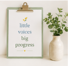 A framed quote on a clipboard that reads 'little voices big progress' with a small yellow heart beneath, next to a white vase with green leafy plant, all on a white surface against a white background.