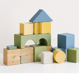 Colorful wooden building blocks arranged in a stack with an arch, forming a small structure.