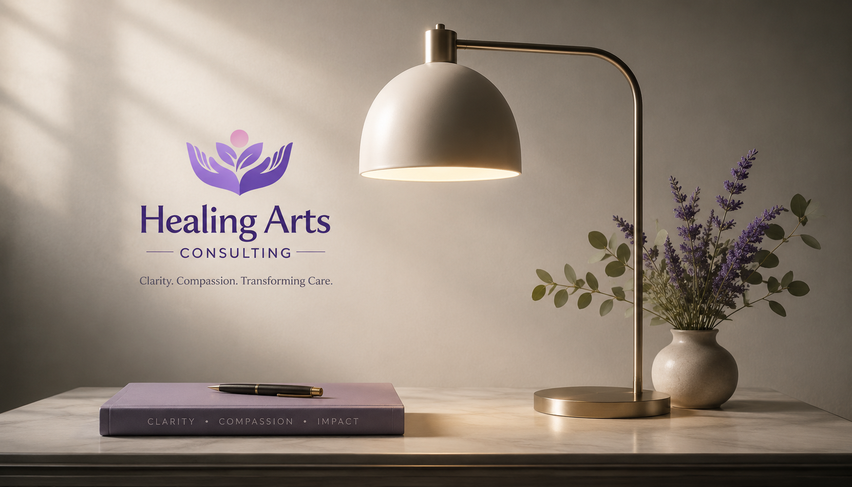 A desk with a purple book and pen, a desk lamp, and a vase of purple flowers and green leaves. A wall with a logo and text reading "Healing Arts Consulting" and the tagline "Clarity. Compassion. Transforming Care."